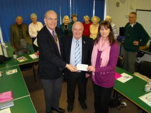 President Brian Roussel and Clive Howells (Chairman, Community and Vocation Committee) present a cheque to the Abergavenny Lip Reading group.